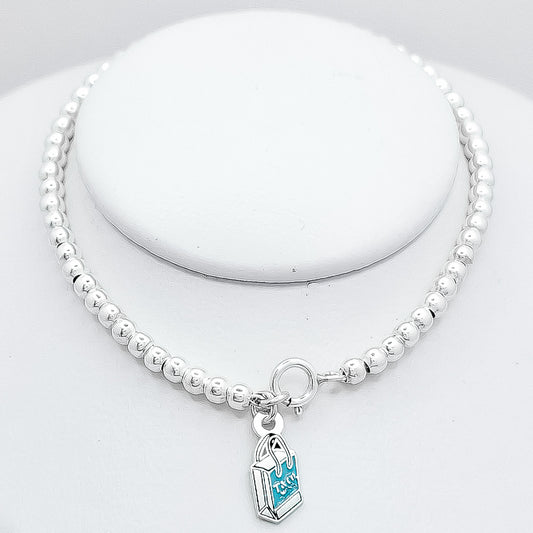 Pulsera Bola Bolso Tiff