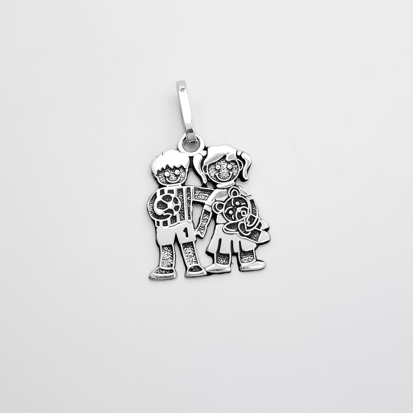 Dije Niño y Niña Pavonado