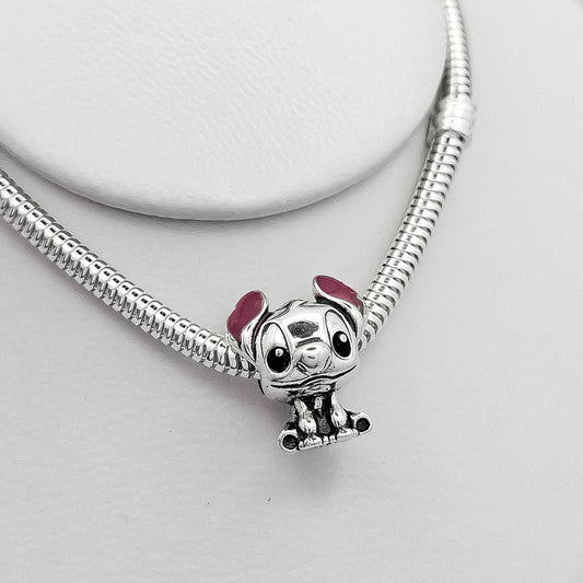 Charm Stich Sentado