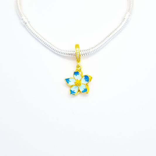 Charm Flor Azul Dorada